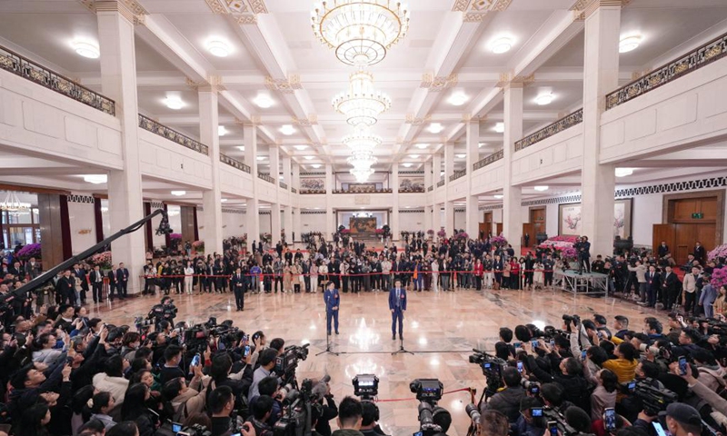 Lei Jun (R in the center), a deputy to the 14th National People's Congress (NPC), attends a group interview ahead of the opening meeting of the third session of the 14th NPC at the Great Hall of the People in Beijing, capital of China, March 5, 2025. Photo: Xinhua